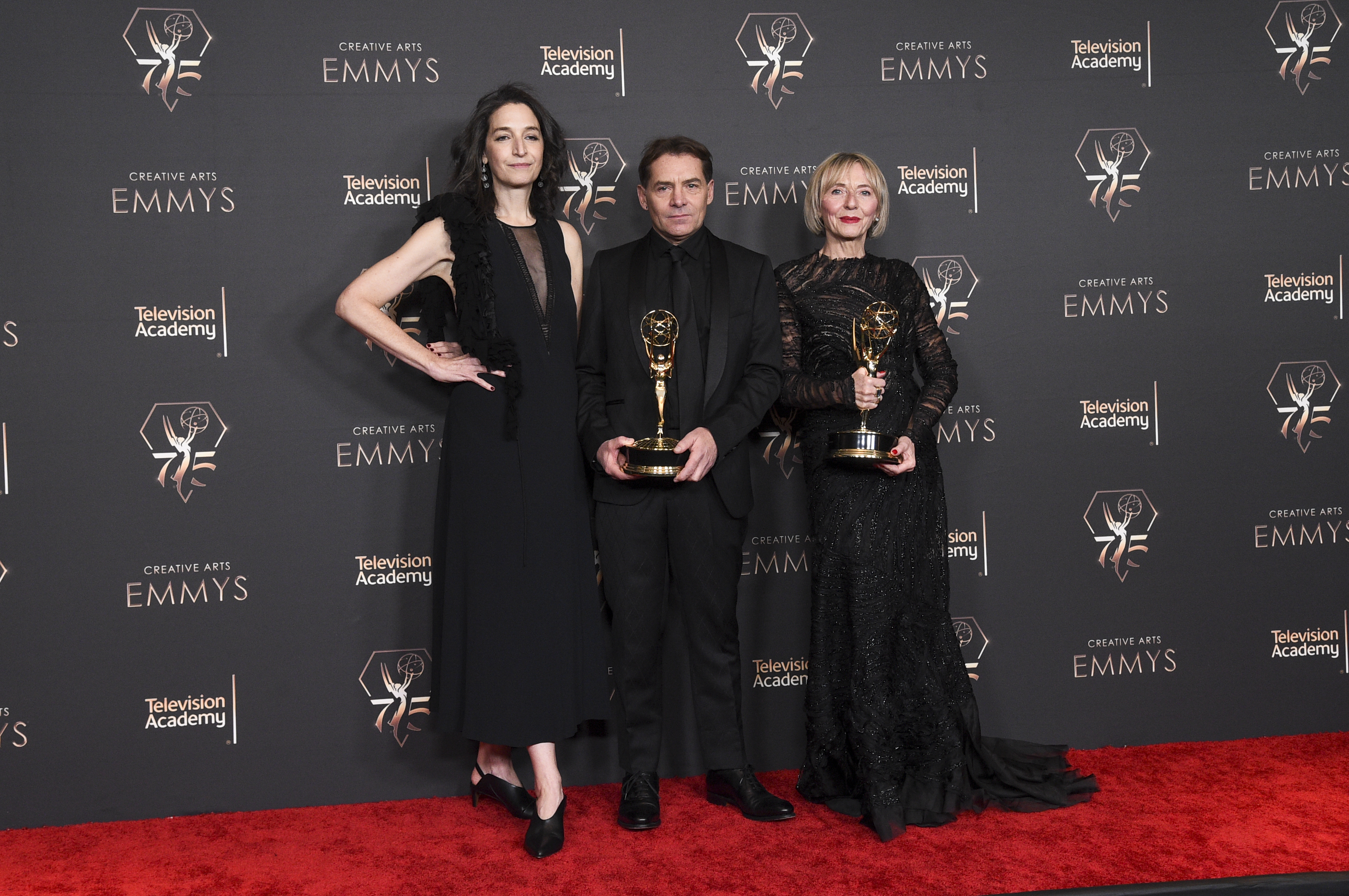 Meredith Tucker, from left, Francesco Vedovati, and Barbara Giordani pose in the press room with the award for outstanding casting for a drama series for "The White Lotus during night one of the Creative Arts Emmy Awards on Saturday, Jan. 6, 2024, at the Peacock Theater in Los Angeles. (Photo by Richard Shotwell/Invision/AP)